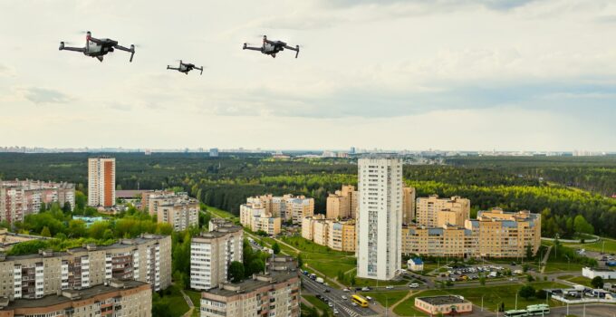 Drones flying over the houses of the city of Minsk. Urban landscape with drones flying over it